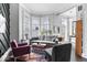 Modern living room with neutral colored furniture, hardwood floors, and plenty of natural light at 914 N Alabama St, Indianapolis, IN 46202