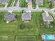 Aerial view of the house, property, deck, and surrounding neighborhood at 1035 White Oak Dr, Plainfield, IN 46168