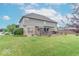 Expansive backyard featuring a well-maintained lawn and spacious deck with a hot tub at 1035 White Oak Dr, Plainfield, IN 46168