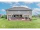 Back of house showcasing large deck with hot tub at 1035 White Oak Dr, Plainfield, IN 46168