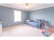 Comfortable bedroom featuring neutral carpet, a pull-out daybed, and a ceiling fan at 1035 White Oak Dr, Plainfield, IN 46168
