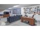 Large bonus room with sofa, desk, TV, and memorabilia at 1035 White Oak Dr, Plainfield, IN 46168