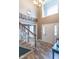 Welcoming foyer with a high ceiling, staircase, and neutral tones, leading to the living areas at 1035 White Oak Dr, Plainfield, IN 46168