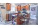 Well-lit kitchen with stainless steel appliances, granite countertops, and ample cabinet space at 1035 White Oak Dr, Plainfield, IN 46168