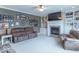 Cozy living room featuring a fireplace, built-in shelving, comfortable seating, and carpeted floors for relaxed living at 1035 White Oak Dr, Plainfield, IN 46168