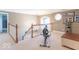 Versatile loft space featuring natural light, exercise equipment, and access to other rooms for flexible use at 1035 White Oak Dr, Plainfield, IN 46168
