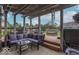 Covered patio with comfortable seating, overlooking the backyard and hot tub at 1035 White Oak Dr, Plainfield, IN 46168