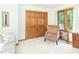 This bedroom is filled with natural light and features a cozy armchair and double-door closet at 10518 Courageous Dr, Indianapolis, IN 46236