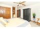 Charming bedroom with a wooden closet and built-in shelving, along with a comfortable bed at 10518 Courageous Dr, Indianapolis, IN 46236