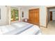 This bedroom features a double-door closet, natural light from a window, and neutral decor at 10518 Courageous Dr, Indianapolis, IN 46236