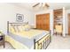 Cozy bedroom with a comfortable bed and carpet floors, and a small desk area at 10518 Courageous Dr, Indianapolis, IN 46236