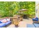 Enjoyable outdoor deck with a comfortable seating area, a table, and a red umbrella at 10518 Courageous Dr, Indianapolis, IN 46236