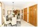 Dining room features a chandelier and neutral decor with views of the adjacent living room at 10518 Courageous Dr, Indianapolis, IN 46236
