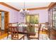 A formal dining room with hardwood floors, a chandelier, and natural light at 10518 Courageous Dr, Indianapolis, IN 46236