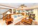 Comfortable living room with hardwood accents and a cozy couch and chair at 10518 Courageous Dr, Indianapolis, IN 46236