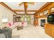 Spacious living room features custom woodwork, a fireplace, and ample natural light from sliding glass doors at 10518 Courageous Dr, Indianapolis, IN 46236