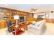 Inviting living room featuring a fireplace, built-in bookshelves, and comfortable seating at 10518 Courageous Dr, Indianapolis, IN 46236