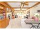 Large living room features custom built-ins, fireplace, wood trim, and bright natural light at 10518 Courageous Dr, Indianapolis, IN 46236