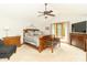 Spacious main bedroom with vaulted ceilings, a ceiling fan, and lots of natural light at 10518 Courageous Dr, Indianapolis, IN 46236