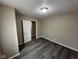 Bedroom with gray wood flooring and white doors at 115 Hugo St, Indianapolis, IN 46229