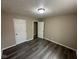 Bedroom with gray wood flooring and white doors at 115 Hugo St, Indianapolis, IN 46229