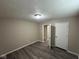 Bedroom with gray wood flooring and white doors at 115 Hugo St, Indianapolis, IN 46229