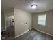 Dining Room featuring new gray wood floors and a large window at 115 Hugo St, Indianapolis, IN 46229
