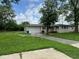 Charming single-story home featuring a one-car garage and a well-maintained lawn at 115 Hugo St, Indianapolis, IN 46229