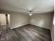 A spacious living room featuring gray luxury vinyl plank flooring, and neutral walls at 115 Hugo St, Indianapolis, IN 46229