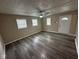 The living room boasts new gray vinyl plank flooring, neutral paint, and white trim at 115 Hugo St, Indianapolis, IN 46229