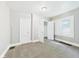 Bedroom with carpet, white trim, a closet, and a bright window overlooking the neighborhood at 1201 Arrow Ave, Anderson, IN 46016