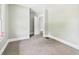 Bedroom with neutral carpet, light gray walls, and white trim at 1201 Arrow Ave, Anderson, IN 46016