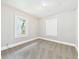 Cozy bedroom with neutral carpet, light gray walls, and one window at 1201 Arrow Ave, Anderson, IN 46016