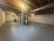 Unfinished basement with painted floor and exposed ductwork perfect for storage or finishing at 1289 Woodcreek Dr, Greenwood, IN 46142