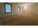 Spacious bedroom with carpet and two large windows at 1289 Woodcreek Dr, Greenwood, IN 46142