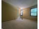 Bedroom features wall-to-wall carpet and windows that provide natural light at 1289 Woodcreek Dr, Greenwood, IN 46142