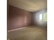 This bedroom features wall-to-wall carpet and a window that lets in natural light at 1289 Woodcreek Dr, Greenwood, IN 46142