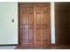 Wooden closet doors with decorative trim and hardwood floors at 1289 Woodcreek Dr, Greenwood, IN 46142