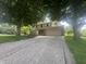 Charming two-story home with a spacious driveway and an attached two-car garage at 1289 Woodcreek Dr, Greenwood, IN 46142