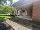 Inviting front porch featuring a decorative glass door and brick accents at 1289 Woodcreek Dr, Greenwood, IN 46142