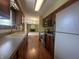 Kitchen featuring wooden cabinets, stainless steel appliances, and hardwood floors at 1289 Woodcreek Dr, Greenwood, IN 46142