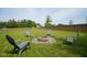 Large backyard with fire pit and seating, perfect for outdoor entertaining at 13074 Lansdowne Dr, Fishers, IN 46038