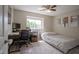 This bedroom features neutral carpet, a bed, and a desk near the window at 13074 Lansdowne Dr, Fishers, IN 46038