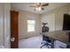 This bedroom has neutral walls, ceiling fan, and a window for natural light at 13074 Lansdowne Dr, Fishers, IN 46038