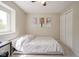 This bedroom features neutral walls and carpet with a bed and window at 13074 Lansdowne Dr, Fishers, IN 46038