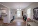 Open dining room with chandelier and space for entertaining, next to the kitchen at 13074 Lansdowne Dr, Fishers, IN 46038