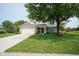 Charming two-story home with attached garage and well-manicured lawn at 13074 Lansdowne Dr, Fishers, IN 46038