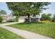 Well-maintained two-story home with a spacious front yard and mature shade tree at 13074 Lansdowne Dr, Fishers, IN 46038