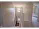 Upstairs hallway with carpet and white trim at 13074 Lansdowne Dr, Fishers, IN 46038