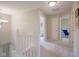 Upstairs hallway with carpet and white trim at 13074 Lansdowne Dr, Fishers, IN 46038